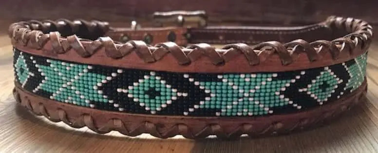 Genuine leather dog collar with teal, white, and black navajo beaded inlay design, a leather wrapped edge