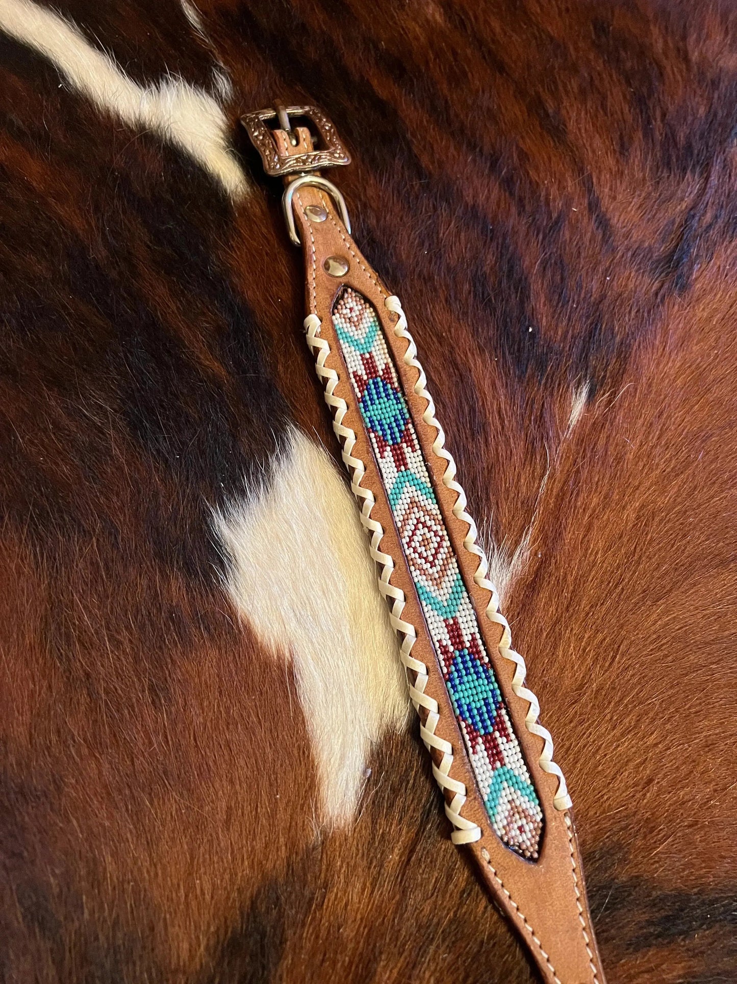 Genuine leather dog collar with teal, white, and burgundy navajo beaded inlay design and Rawhide edge