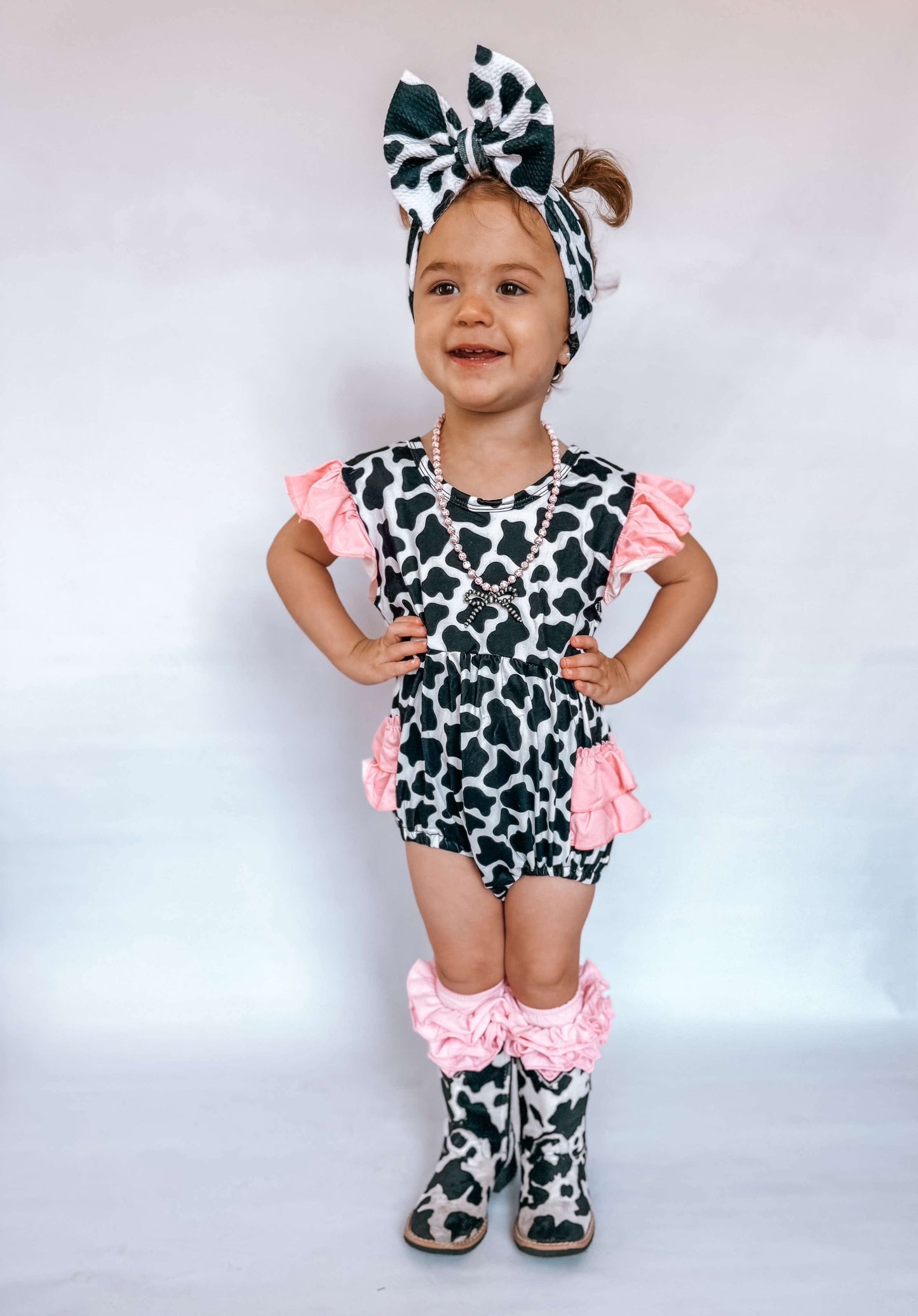 Cow Print With Pink Ruffles Romper (FINAL SALE)