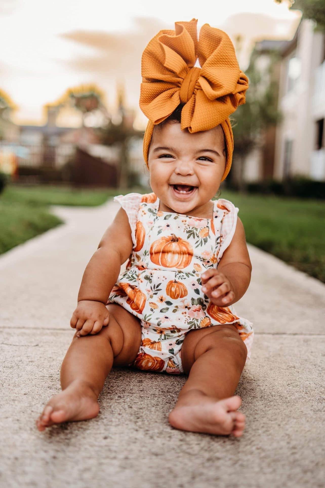 Floral pumpkin ruffle romper