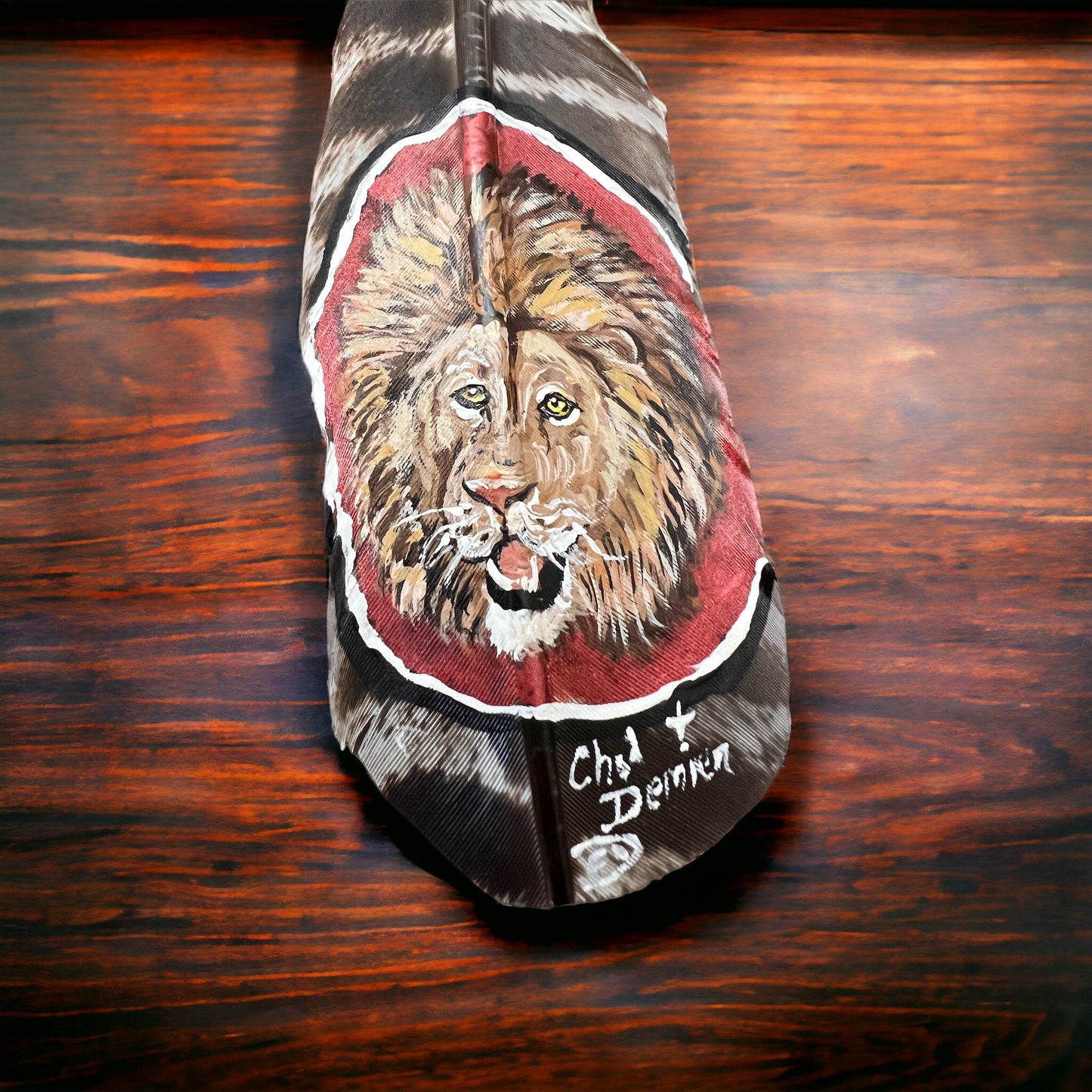 Painted hat feather by Chad Demien - Lion