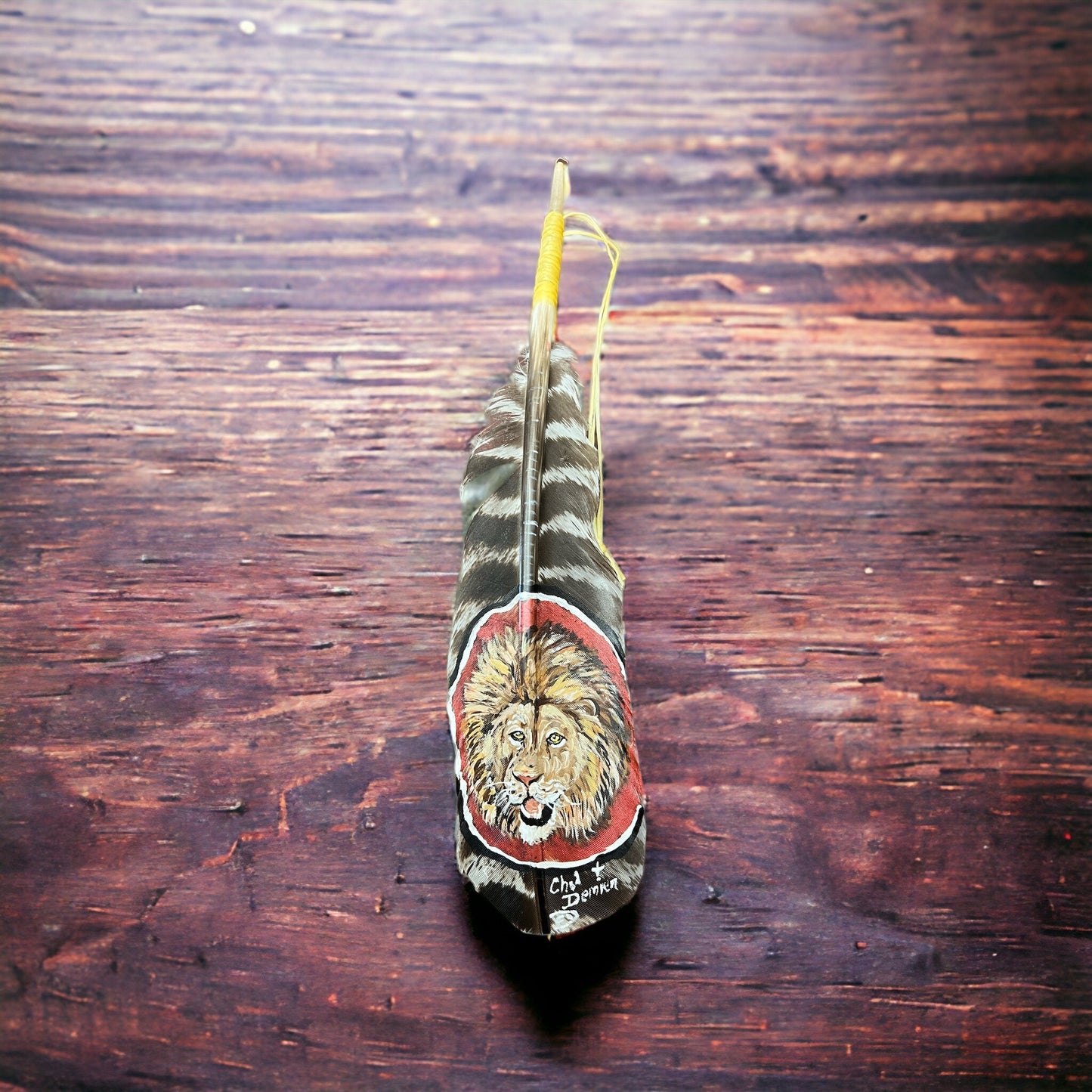 Painted hat feather by Chad Demien - Lion